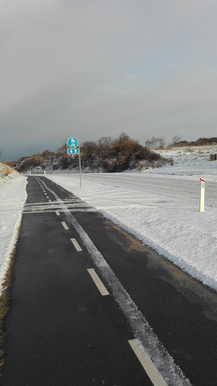 Winter in Denmark. The bike path has been cleared of snow, but the road hasn't