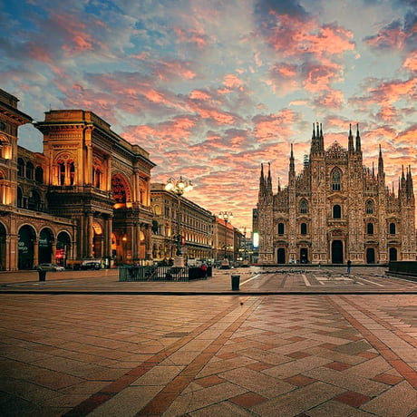 The sunset lingers over the Duomo di Milano, the second largest