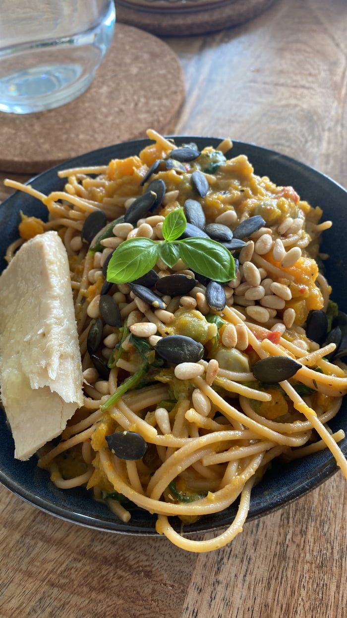 Lentil pasta with pumpkin sauce, spinach and tuna on the side. Topped