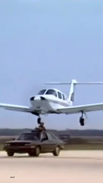 A man pull the wheel of  flying plane