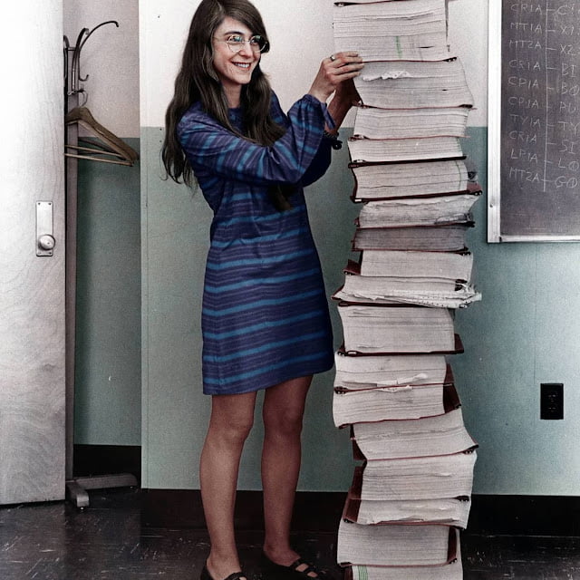 Margaret Hamilton, NASA's lead software engineer for the Apollo Program standing next to code she and her team wrote that took humanity to the Moon in 1969.