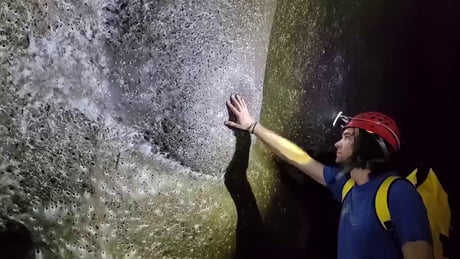 Romanian researchers recently uncovered the world's largest known spider web, a 106 m² communal structure in Sulfur Cave on the Albania-Greece border, housing over 111,000 spiders from two rival species that coexist without aggression for the first time observed.