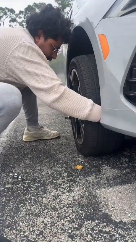 Just casually fixing a flat tire with a jack-less technique