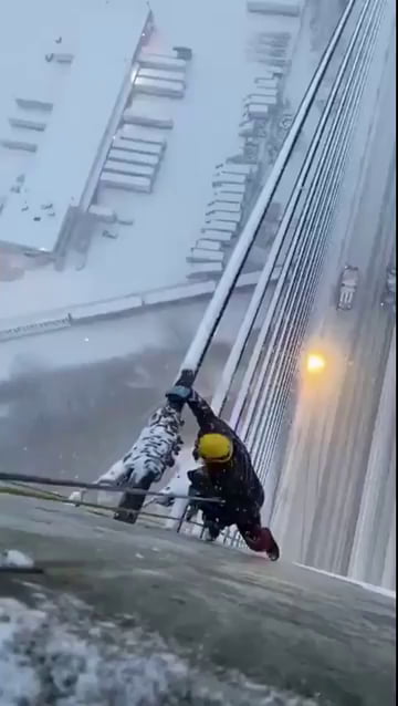 Removing snow from bridge cables