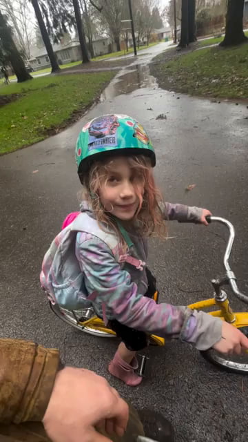 Little girl's adventure in a big puddle