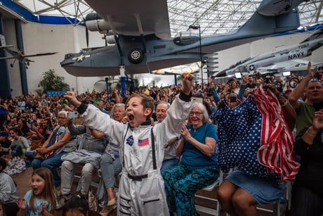 Crowd cheers watching Artemis II return to Earth