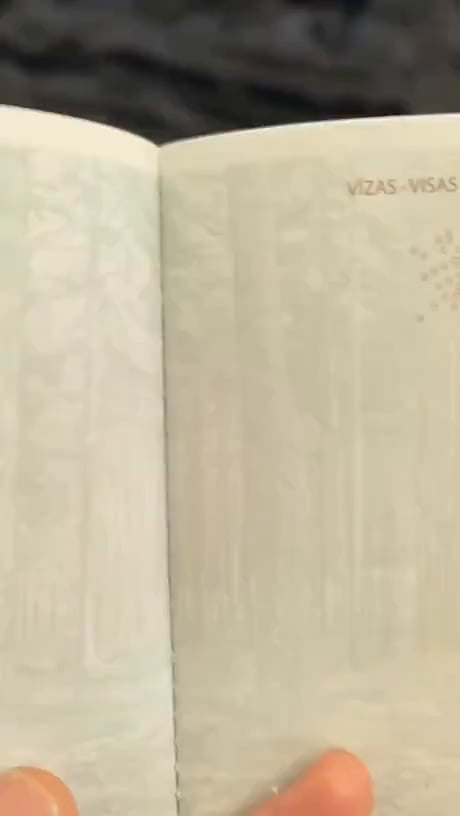 Latvian passport under UV light - Good luck to counterfeit that