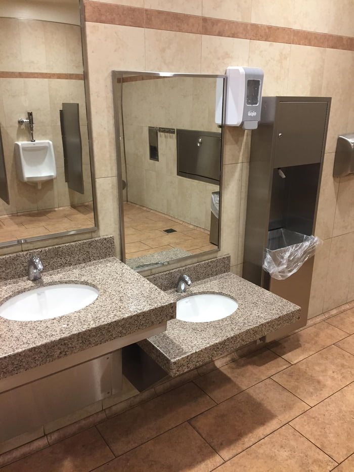 This Walmart bathroom that has a lowered sink but the soap dispenser is not.