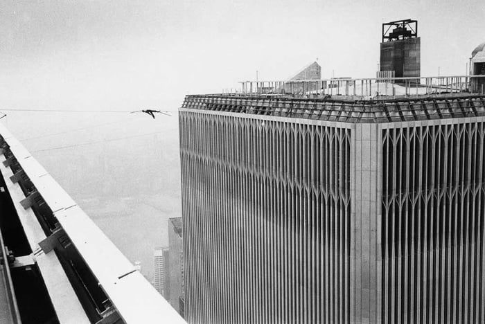 French high-wire artist Philippe Petit lying down on a tightrope ...