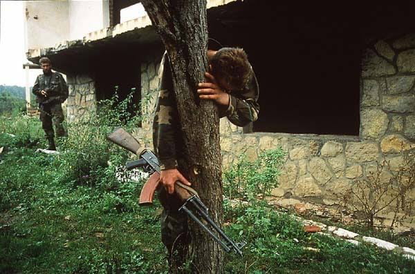 Senad Medanovic, sole survivor of a massacre finds his home in ruins after the Bosnian army recaptured his village from Serbian forces. He is standing on what is believed to be a mass grave of 69 people, including his family. Bosnia, 1995.He died today