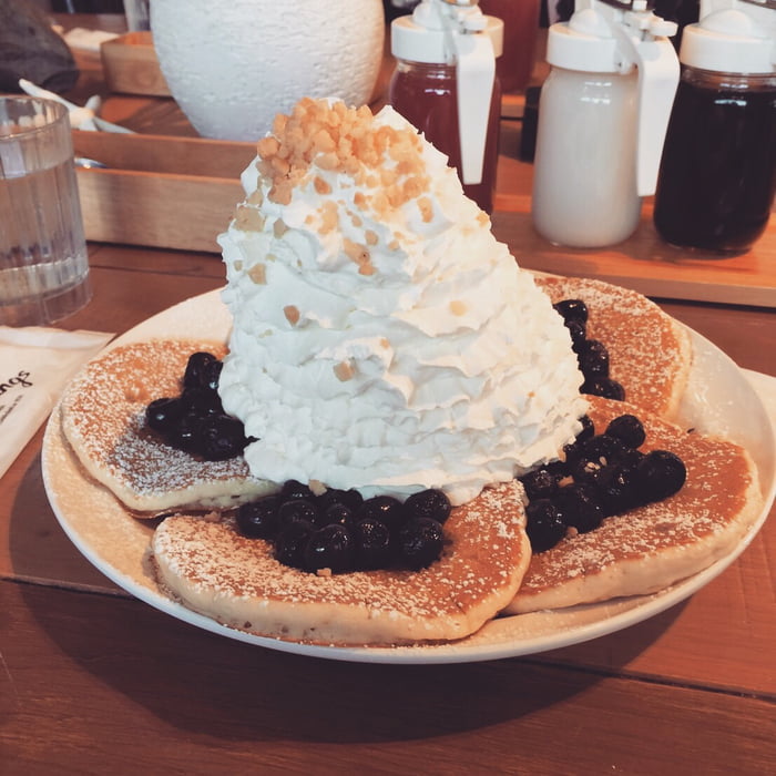 Blueberry pancakes with a little whipped cream