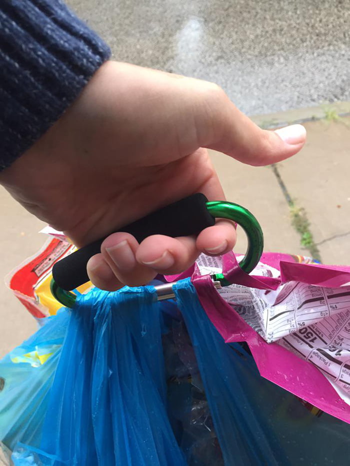 A large carabiner with a sponge grip makes carrying groceries a more pleasant experience for your fingers.