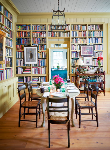 Dining Area With A Wall Of Bookshelves, Library Of Dining Room