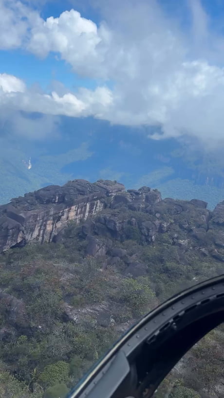 Angel Falls is a waterfall in Venezuela. It is the world's tallest uninterrupted waterfall, with a height of 979 metres, and a plunge of 807 m. The waterfall drops over the edge of the Auyán-tepui mountain in the Canaima