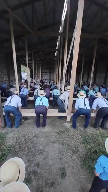 Amish community moving a barn together, talk about teamwork