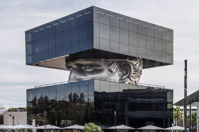 This mall in France has a giant sculpture of Julius Caesar in its center, to promote contemporary art.