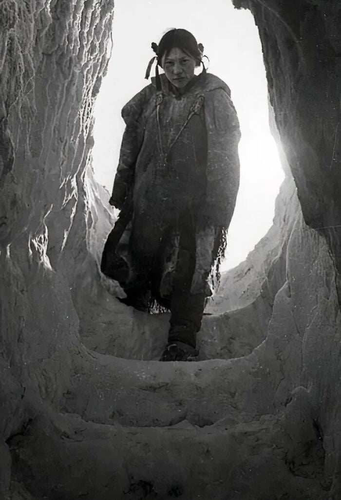 In 1949, in Arviat, Nunavut (Northern Canada), an Inuit woman descends ...