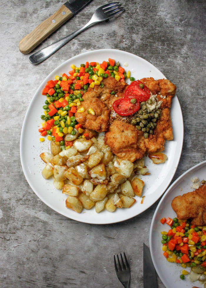Pork Schnitzel topped with freshly grated horseradish & capers, served