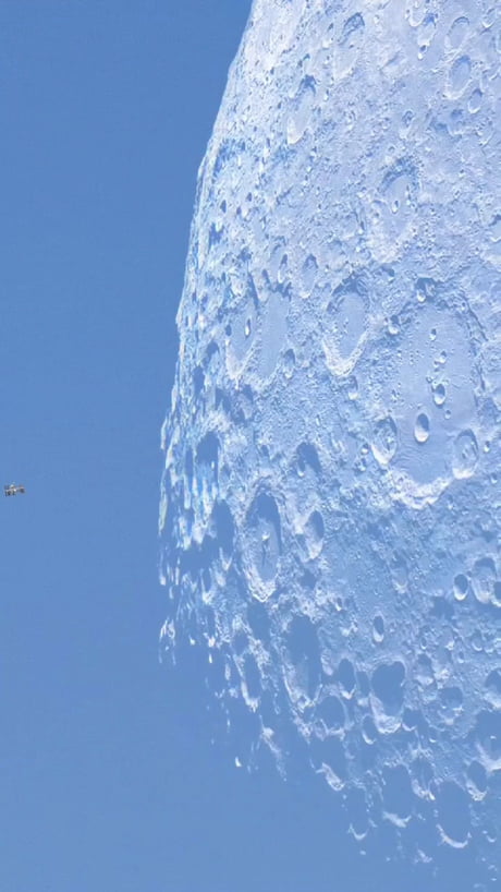 The International Space Station was captured gliding across the face of the Moon