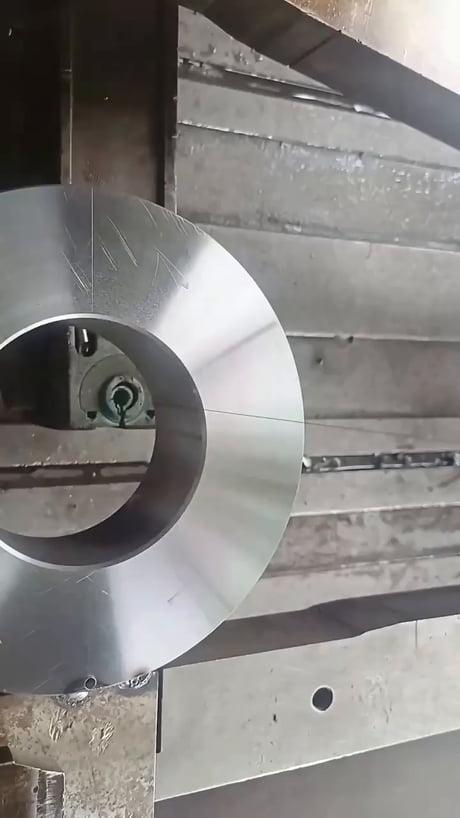 Watch this wire EDM machine carve out perfect gear teeth
