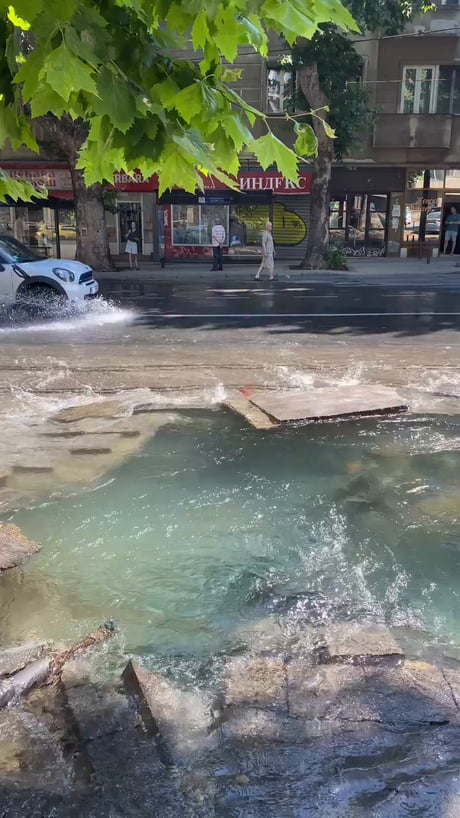 How to cool down during the heatwave Balkan style? Just blow the water pipes beneath the streets. Instant cooling.