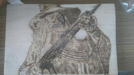 A Woodburned Gandalf With An Ak 47 Post Your Next Requests In