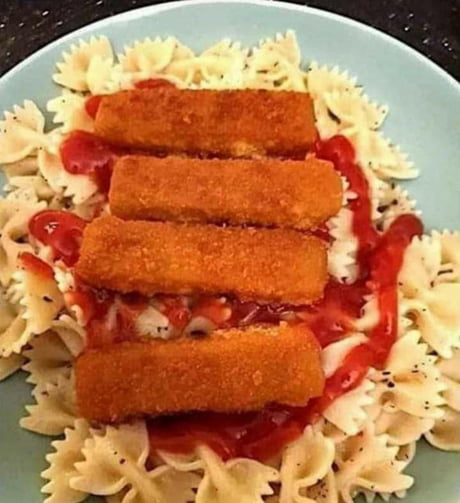Pasta with breaded fish filets and sweet tomato reduction