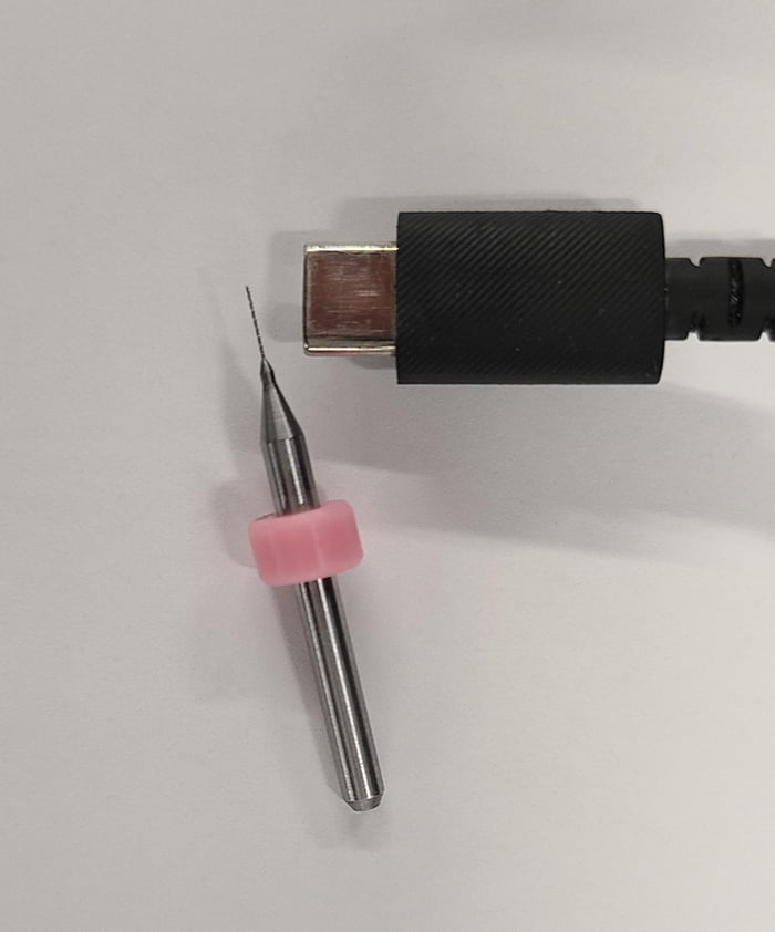 A drill bit tenthousandths of an inch in diameter, used to drill holes