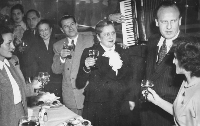 Oskar Schindler at a party with some of the people that he saved during ...