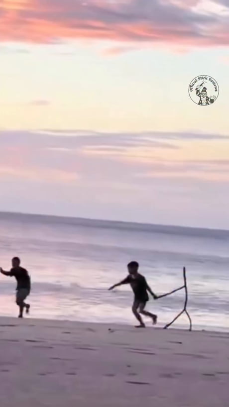 Most boys only find a stick sword. This dude found a stick buddy.