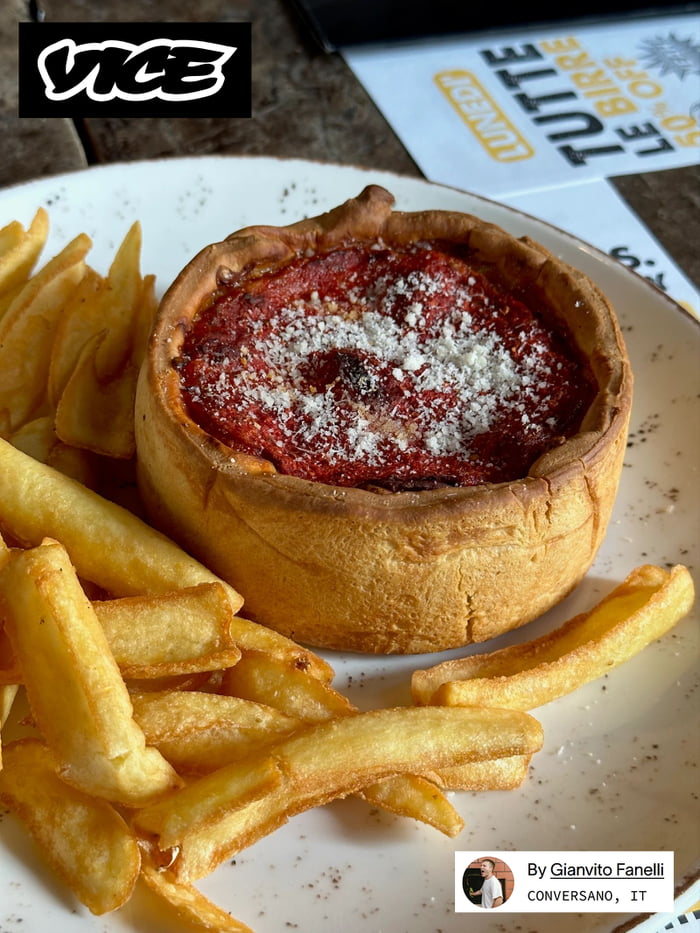 ChicagoStyle Deep Dish Pizza as served in Milan. Mozzarella at the