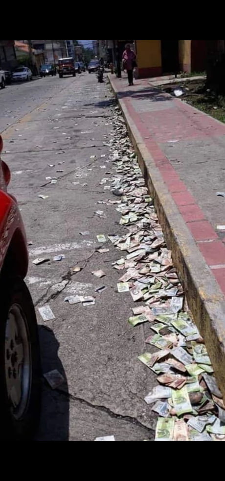 Worthless currency litters the street in Venezuela.