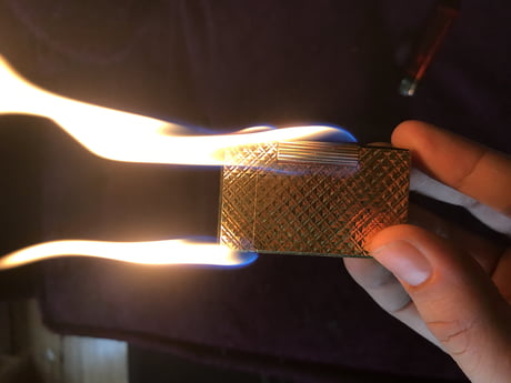 This fake dupont lighter that has Gas coming out of every place - 9GAG