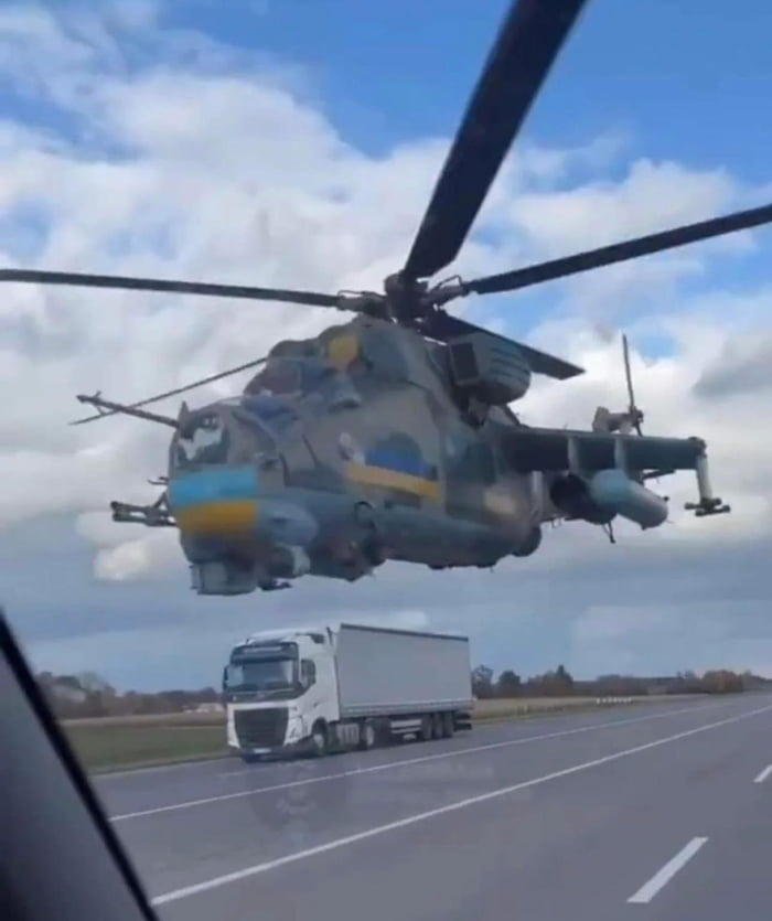 Ukrainian helicopter flying with the freeway traffic to avoid Russian radar