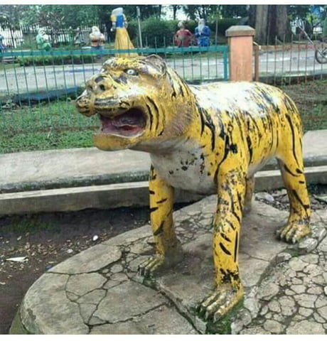 One more tiger statue that made in  this one without teeth. -  9GAG