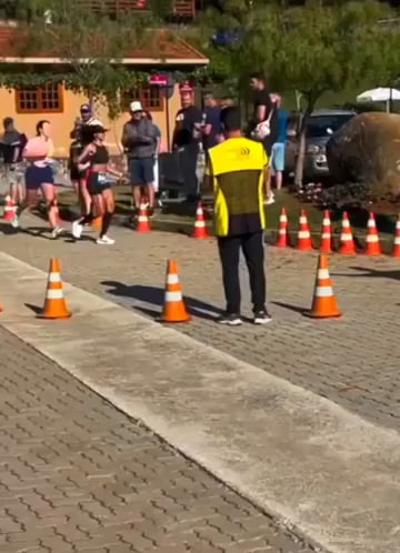 Runner purposefully pulls barricades to win the race