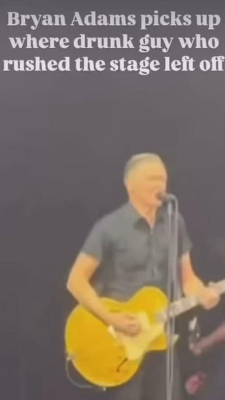 This drunk guy crashing Bryan Adams' stage is peak concert energy