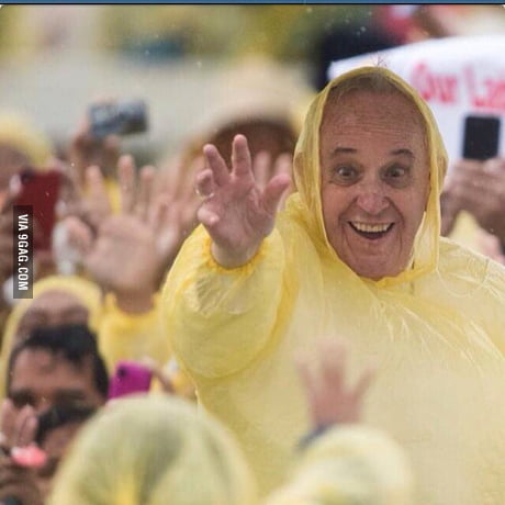 An awesome cute phote of Pope Francis wearing a yellow raincoat in Tacloban  City Philippines. -photo by johannes eisele - 9GAG