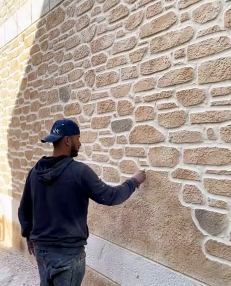 Artist creates a beautiful stone wall from lime plaster