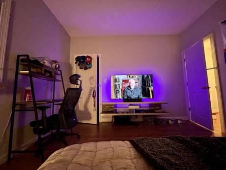 tv above desk in bedroom