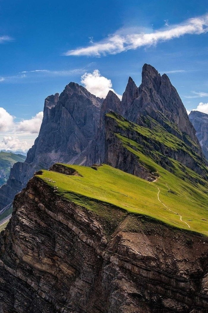 The Dolomites are a mountain range located in northeastern Italy. They ...