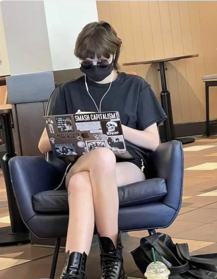 Oh the irony! Smashing capitalism with her overpriced macbook and frappe, or whatever the hell she is drinking.