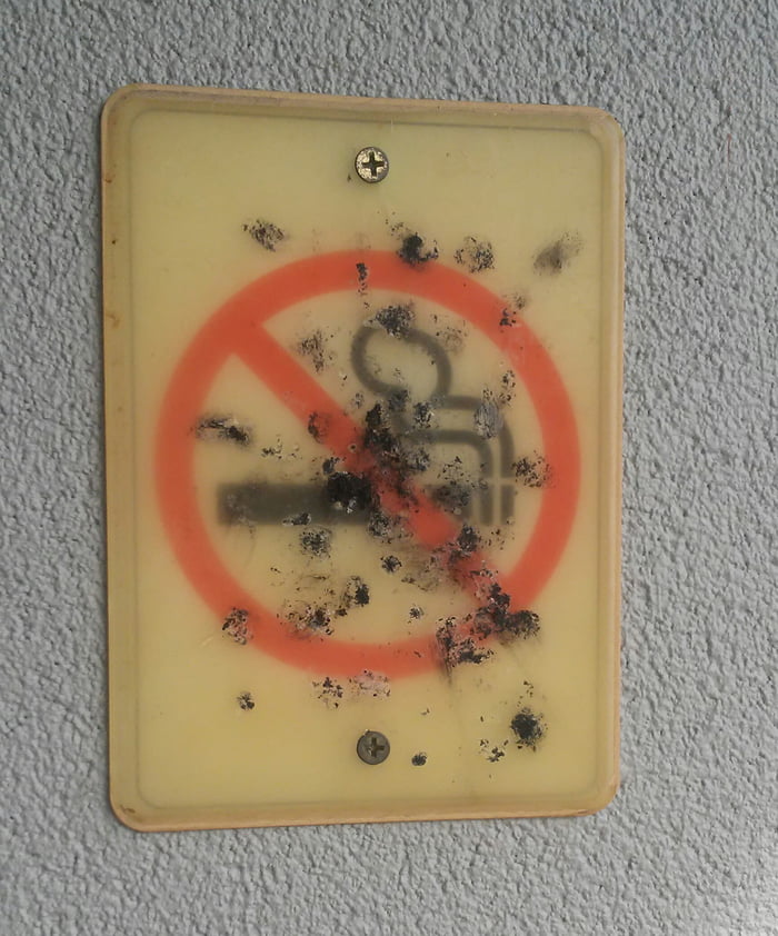 This "no smoking" sign right outside of WalMart's enteance