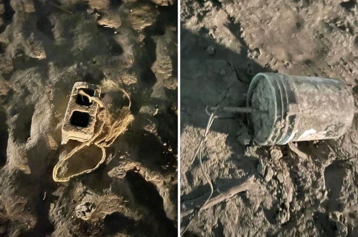 Cinder blocks and cement-filled buckets with ropes tied to them found at the bottom of a dried up dam