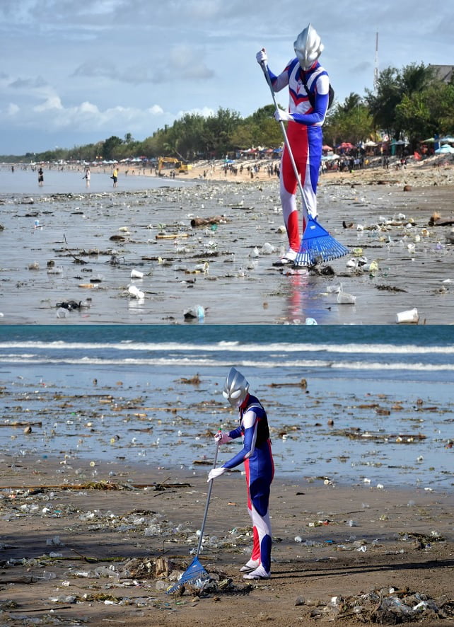 Japanese citizen, Suzuki Hiromasa, wearing an Ultraman costume while cleaning up trash on Kuta Beach, Badung, Bali, Indonesia.
