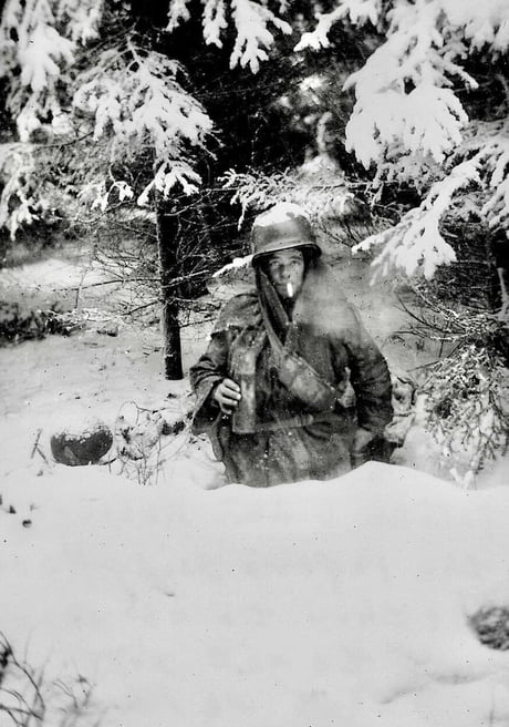 Pfc George A Guckenberger, D Company, 2nd Battalion, 506 Parachute Infantry Regiment, 101st Airborne Division in his foxhole near Bastogne. Circa January 1945, He was killed in action on January 14th 1945, aged 22