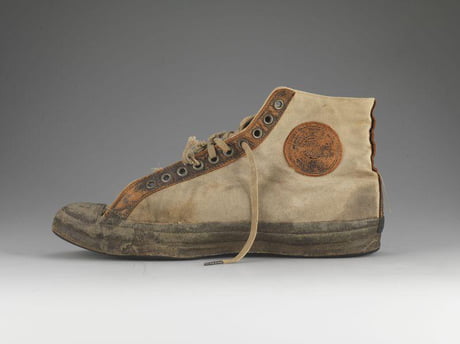 The Converse began in 1908 when Marquis Mills started to make shoes that  heavily featured rubber in their construction, and from that, the 'Converse  Rubber Shoe Company' was formed. The Converse All-Star