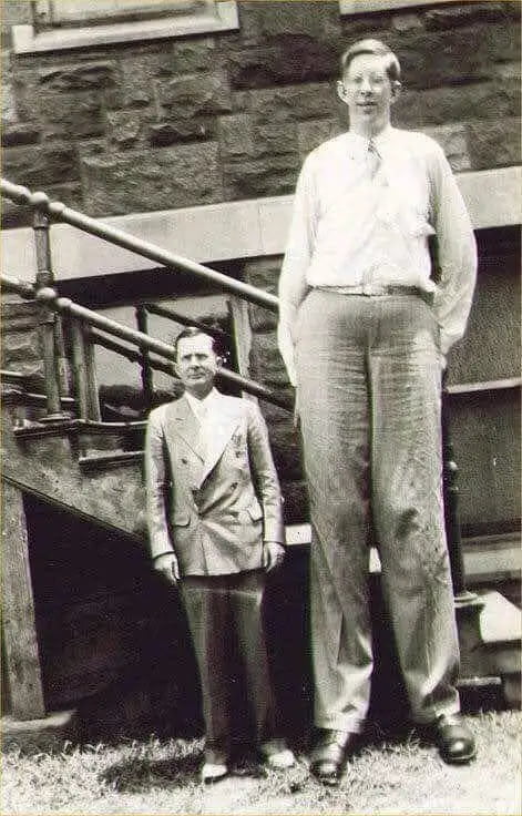 Robert Wadlow, the tallest human ever at a whopping 8’11”, standing ...