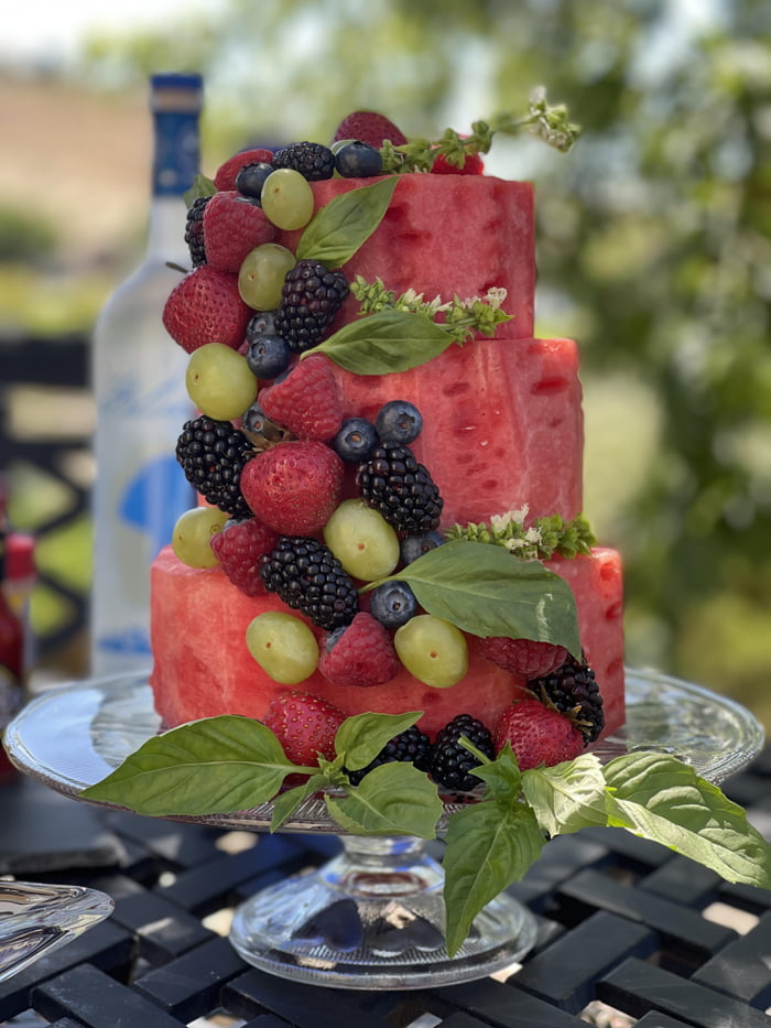 Watermelon Cake with berries and grapes and basil held in with ...