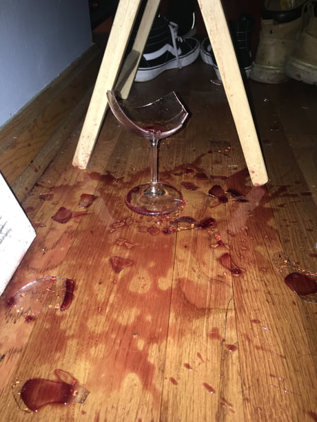 broken wine glass on floor